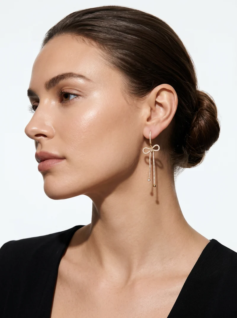 Orecchini cerchio con fiocco e strass - Oro
