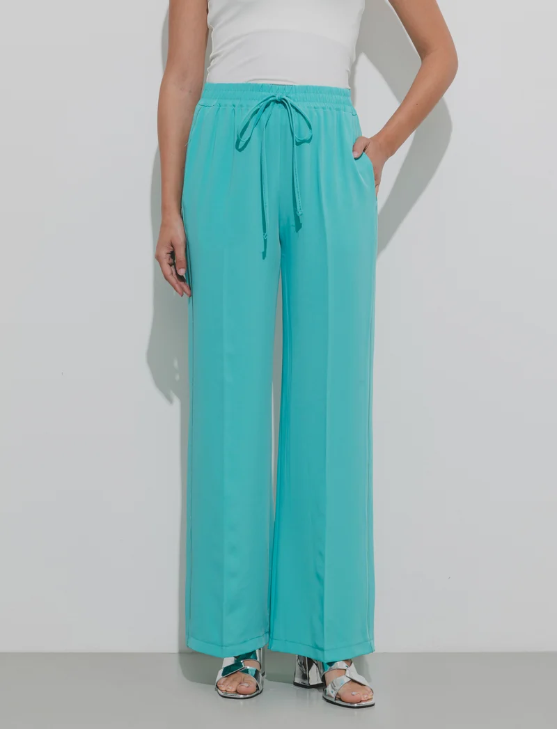 Pantalone palazzo con vita elasticizzata e coulisse regolabile. - Verde acqua